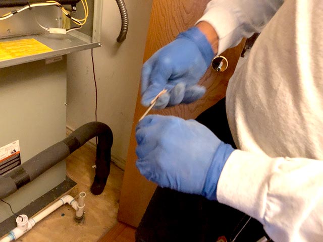 Cleaning a customer's flame sensor