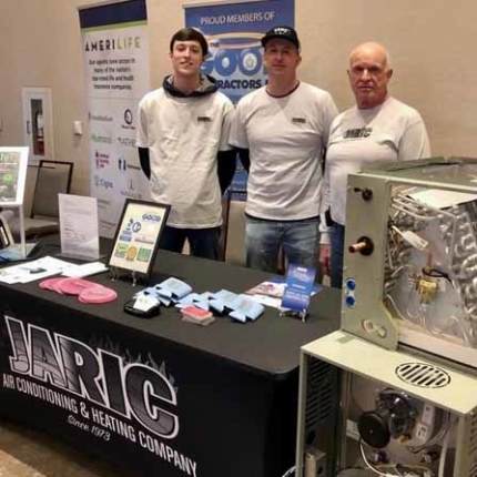 Owner, Jim Richmond, and crew members at a local trade show in Plano TX