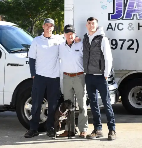 Owner Jimmy Richmond poses with his trusty crew of AC repair technicians.