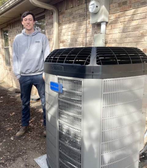 A qualified AC installation tech after a job well done